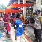 Bhabinkamtibmas Melakukan Patroli Sambang di Pasar Tradisional Desa Tabulo